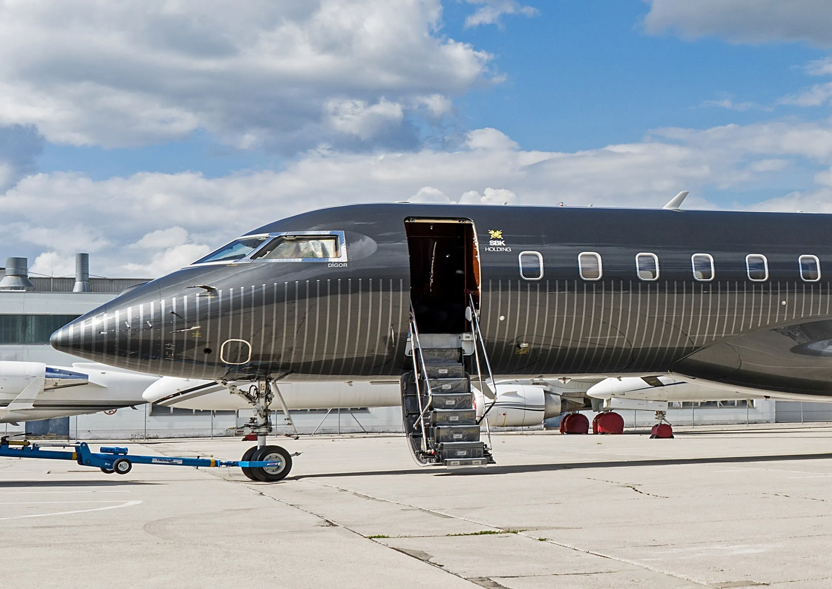 Dark business jet with a polished custom exterior finish
