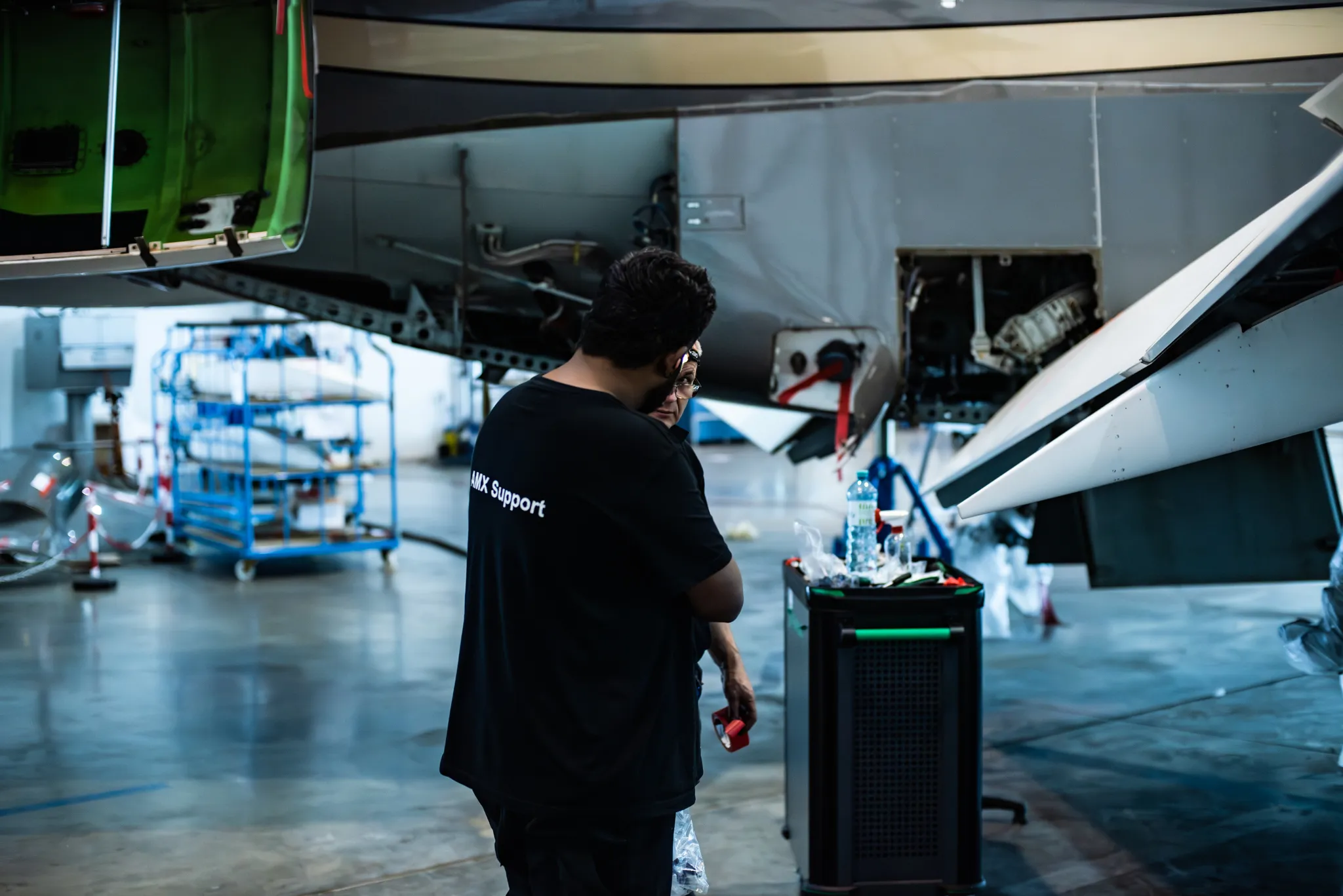 Technician working on a business aircraft in the hangar